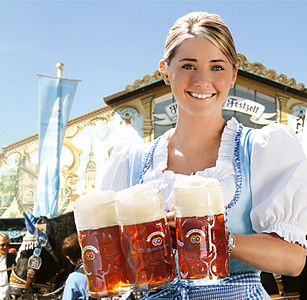 Oktoberfest girl delivering beer.