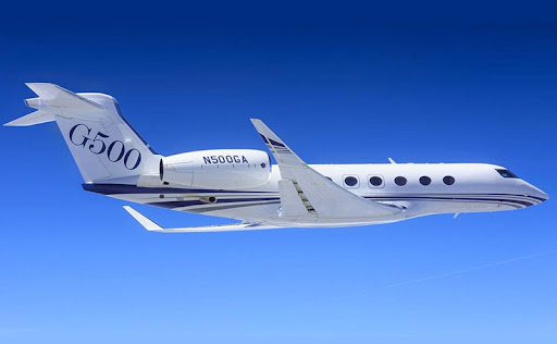 A Gulfstream G500 private jet flying through the air