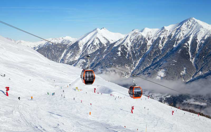 Two ski lifts going up the mountains of Bad Gastein Austria