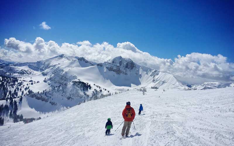 people skiing on the mountains of Banff Canada