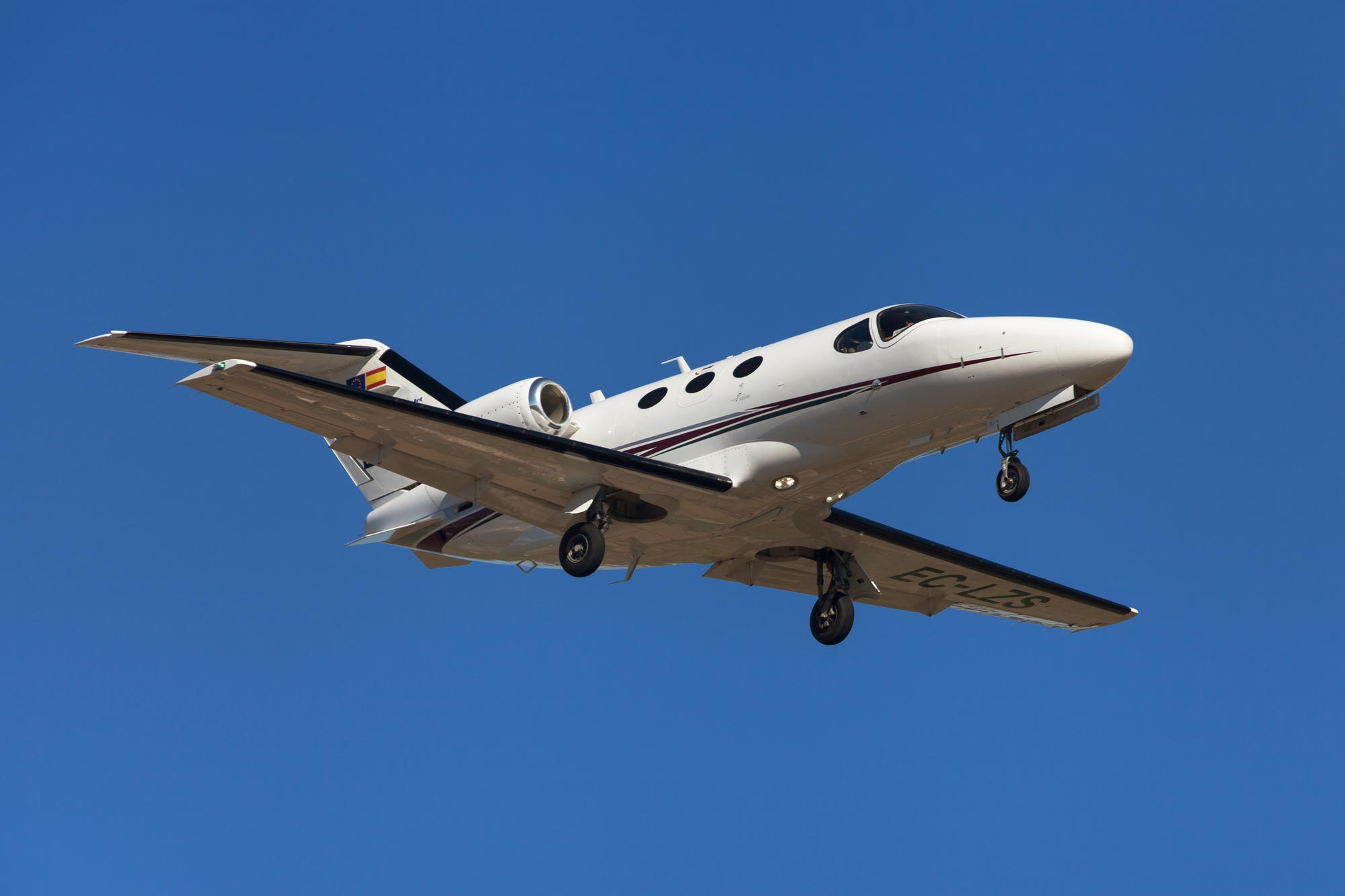 a Cessna Citation Mustang private jet flying through the air