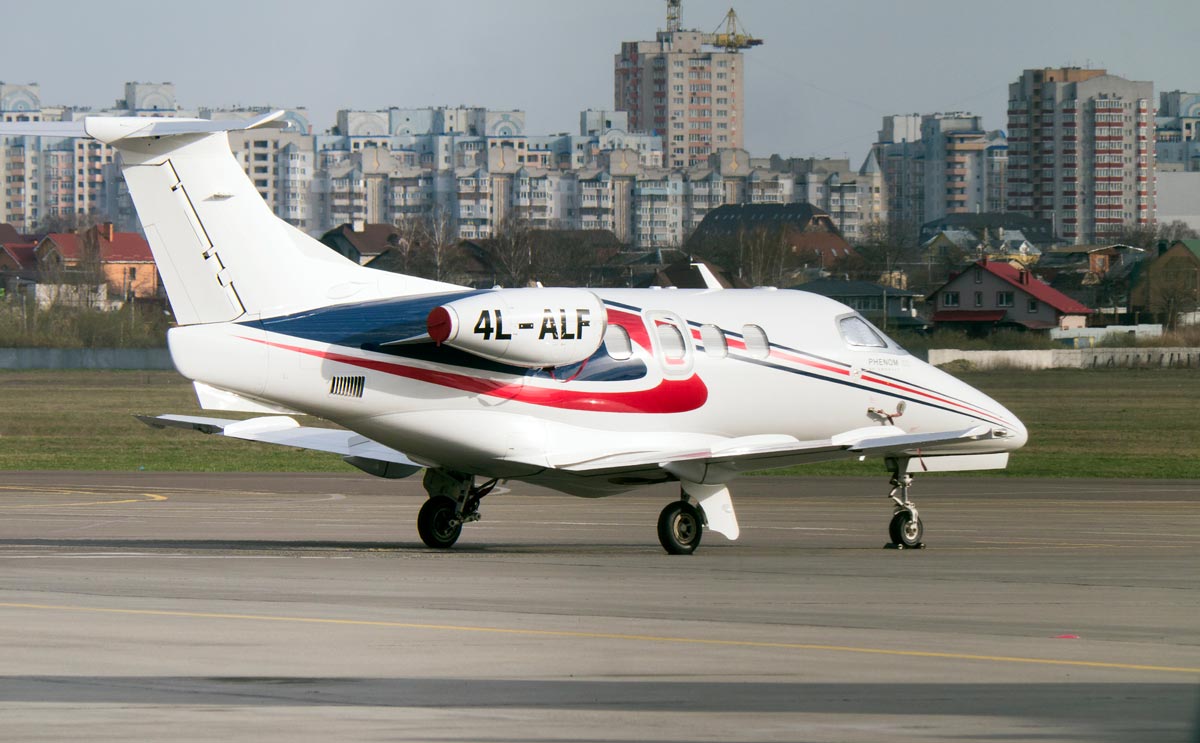 An Embraer Phenom 100 private jet waiting for departure