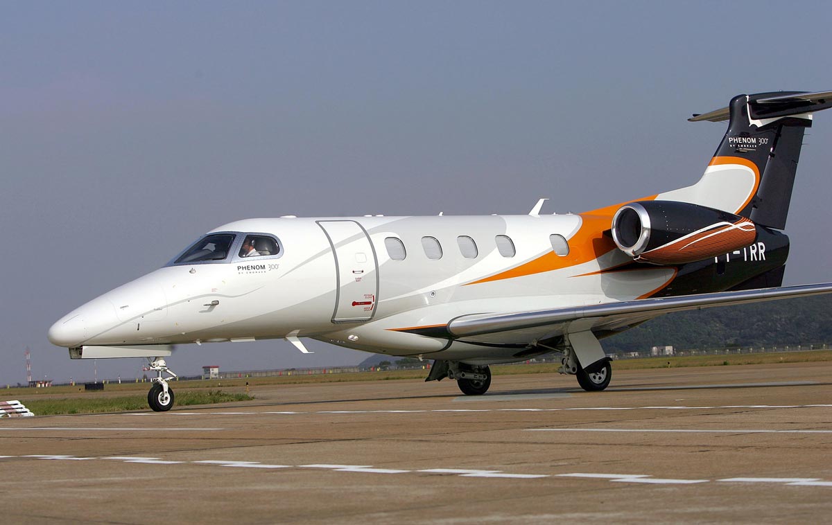 An Embraer Phenom 300 private jet waiting for departure