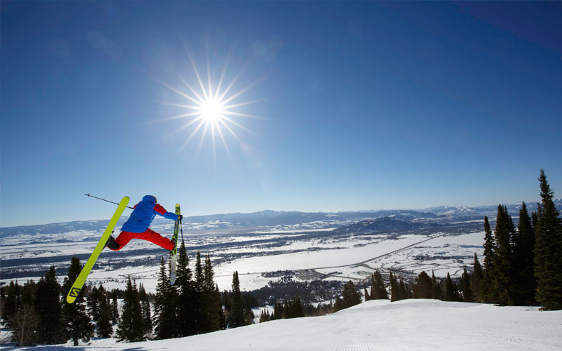 Jackson Hole Mountain Resort, man doing a job with skis