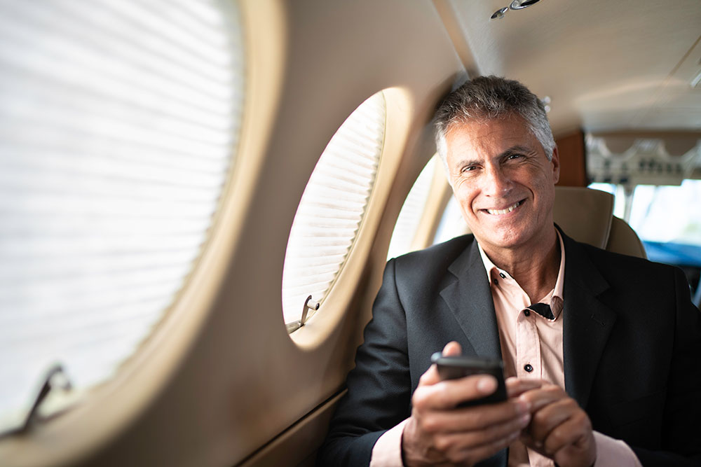 Gentleman Smiling on Private Jet