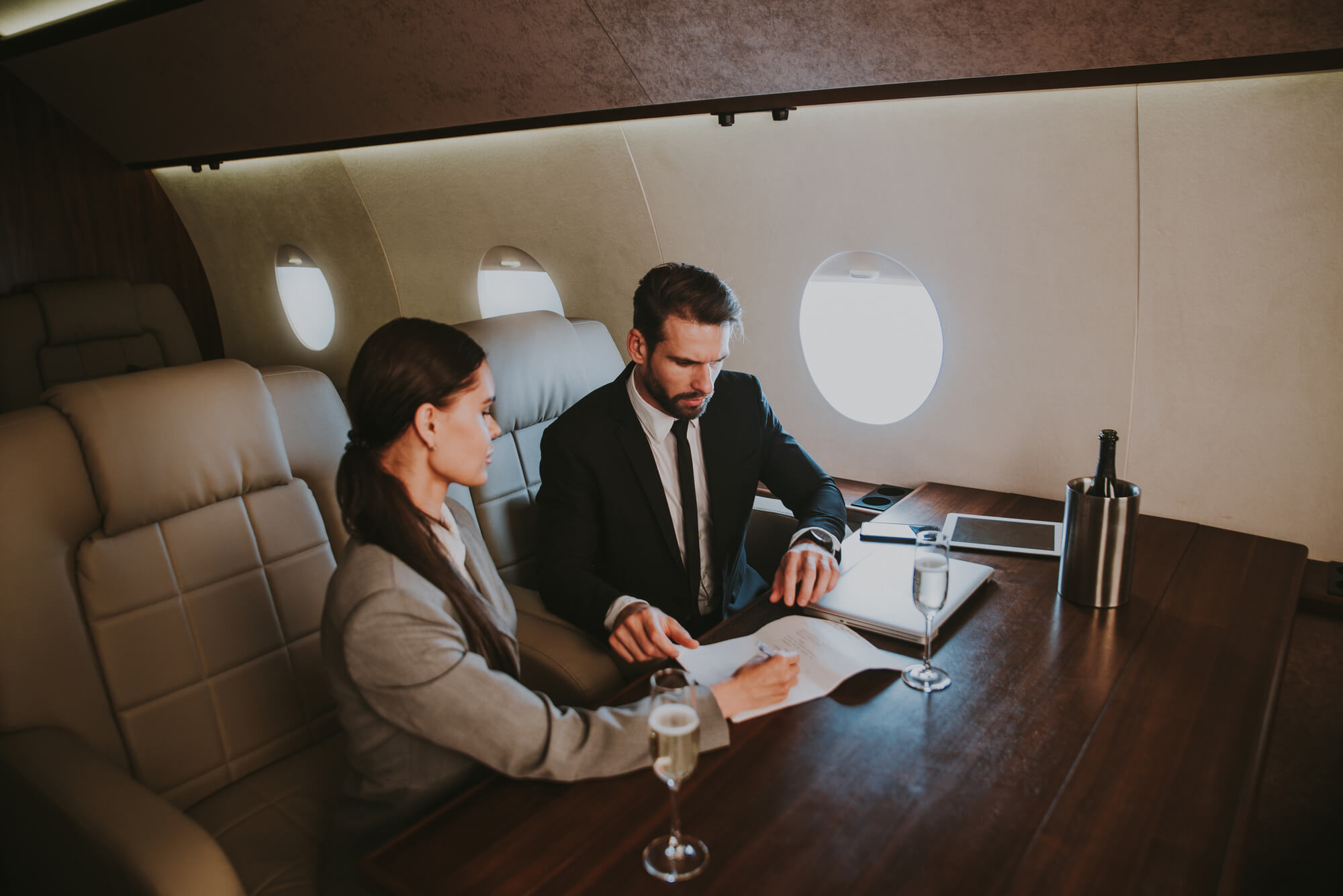 two people are working in the private jet 