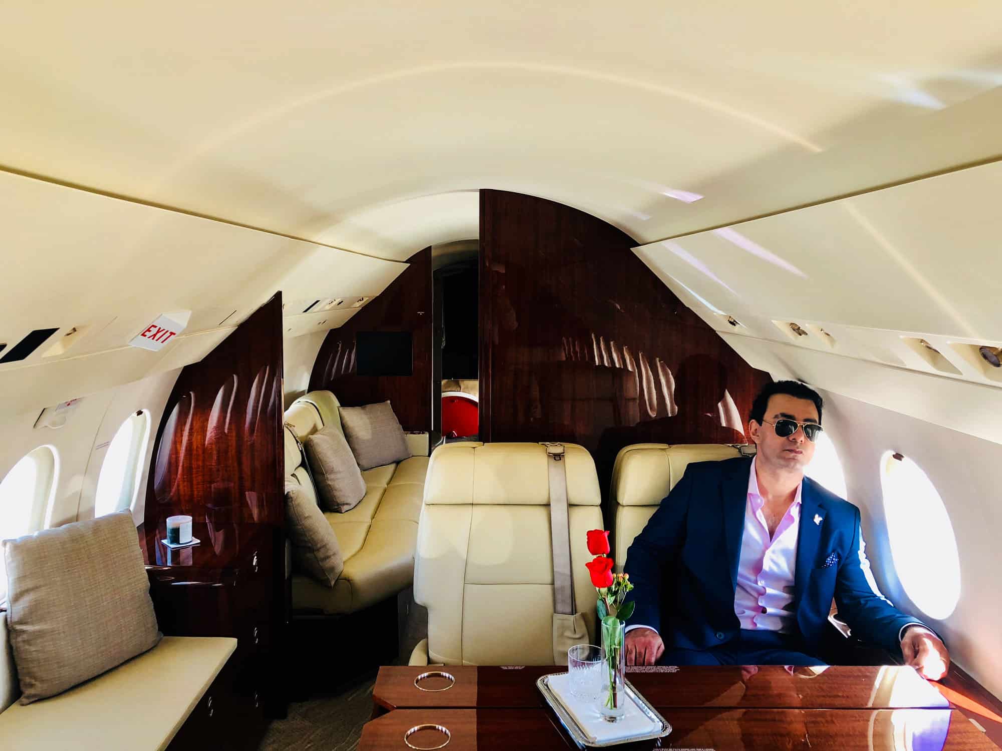 Richard Zaher sitting in a private jet