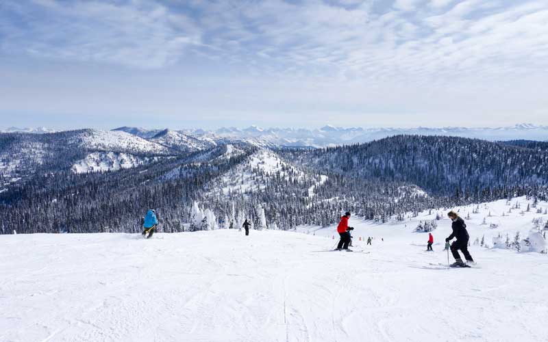 People skiing on the mountains of Yellow Stone Montana