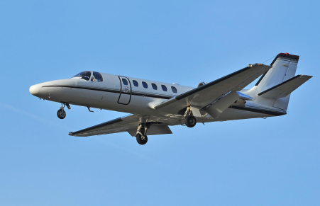 Cessna Citation X private jet flying through the sky